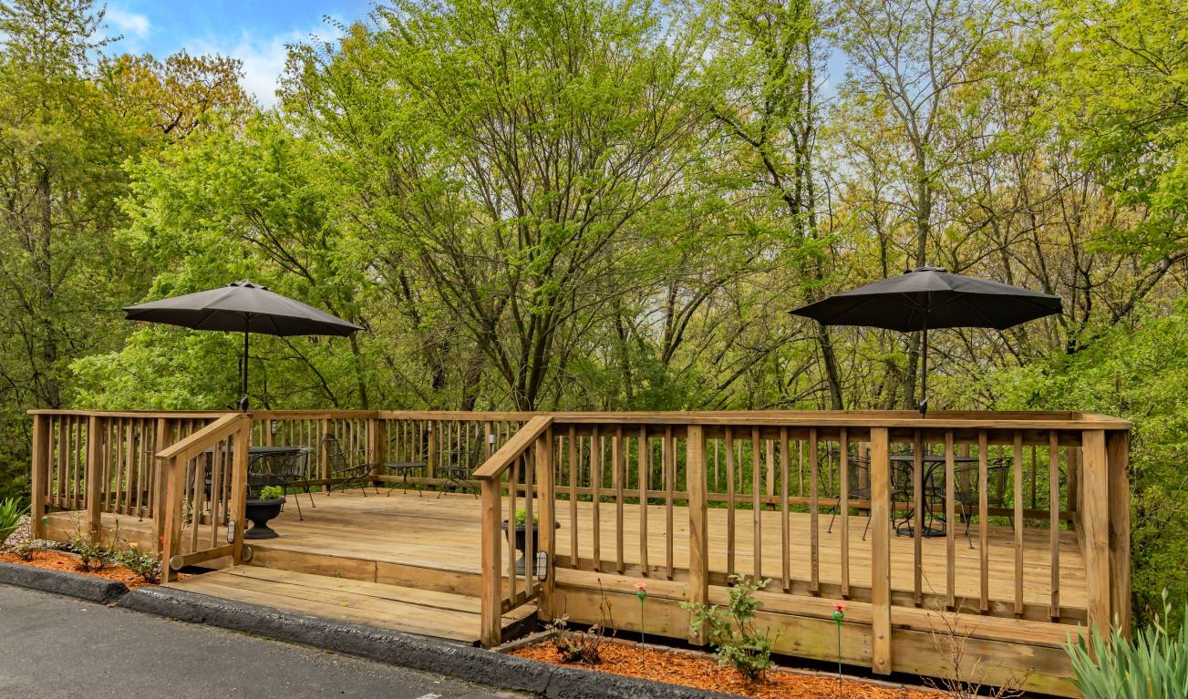 Wooded deck seating area at Autumn Creek Branson