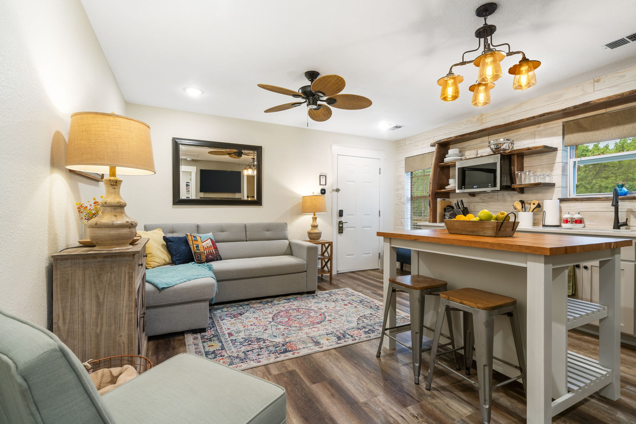 Two-bedroom suite kitchen, bedrooms, and living area with warm lighting.